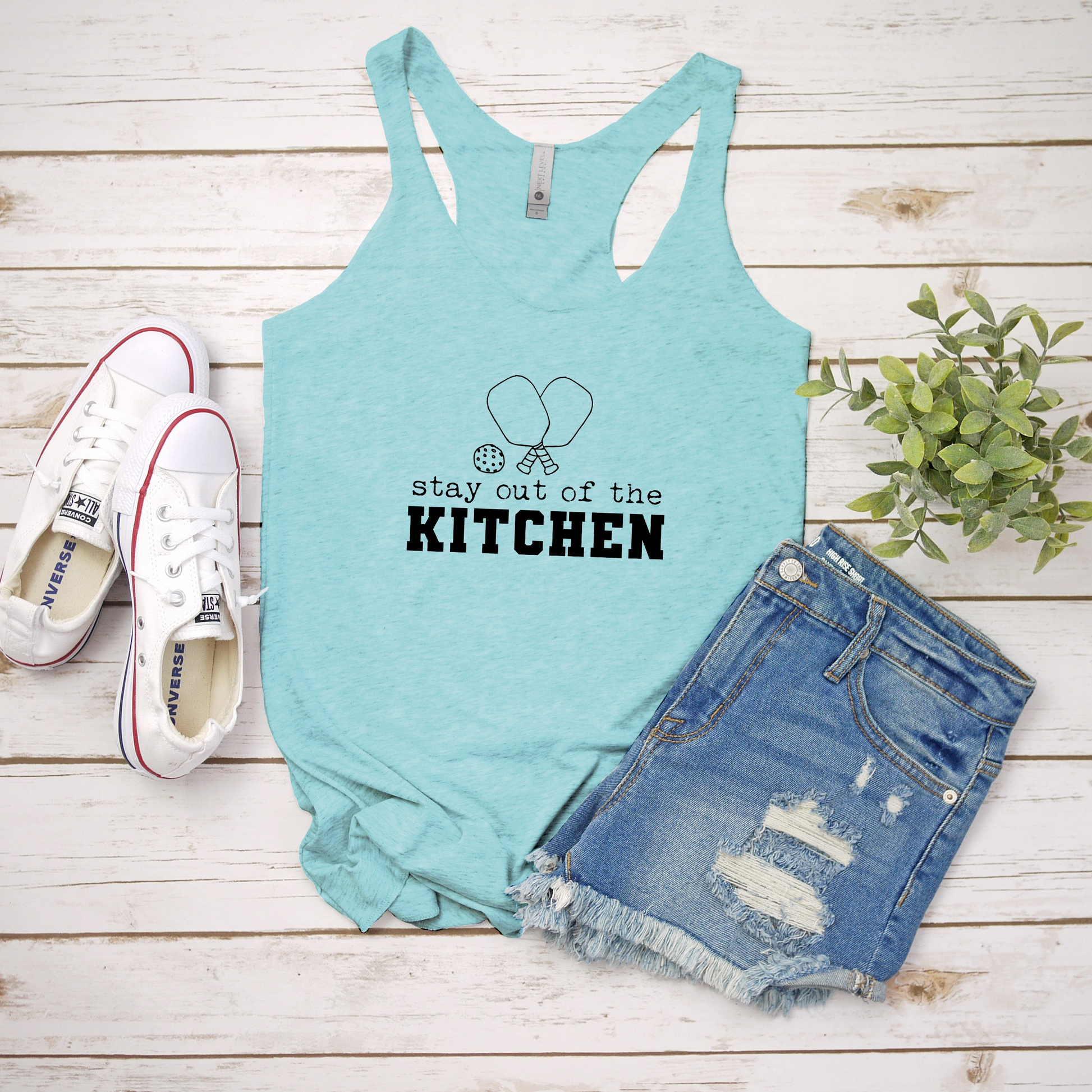 a tank top that says stay out of the kitchen