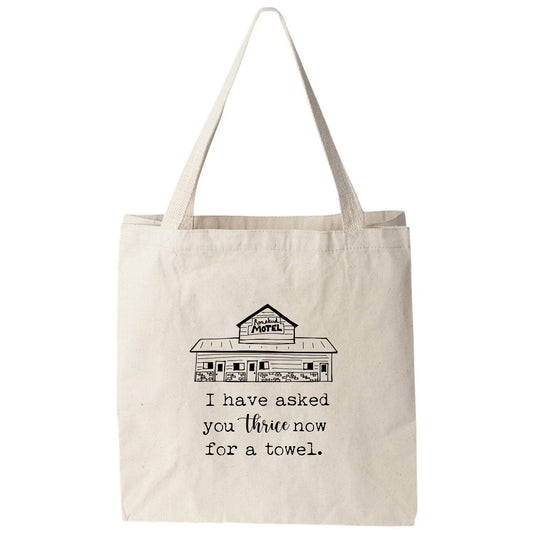 a tote bag that says i have asked you throw for a towel
