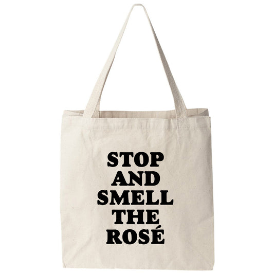 a tote bag that says stop and smell the rose