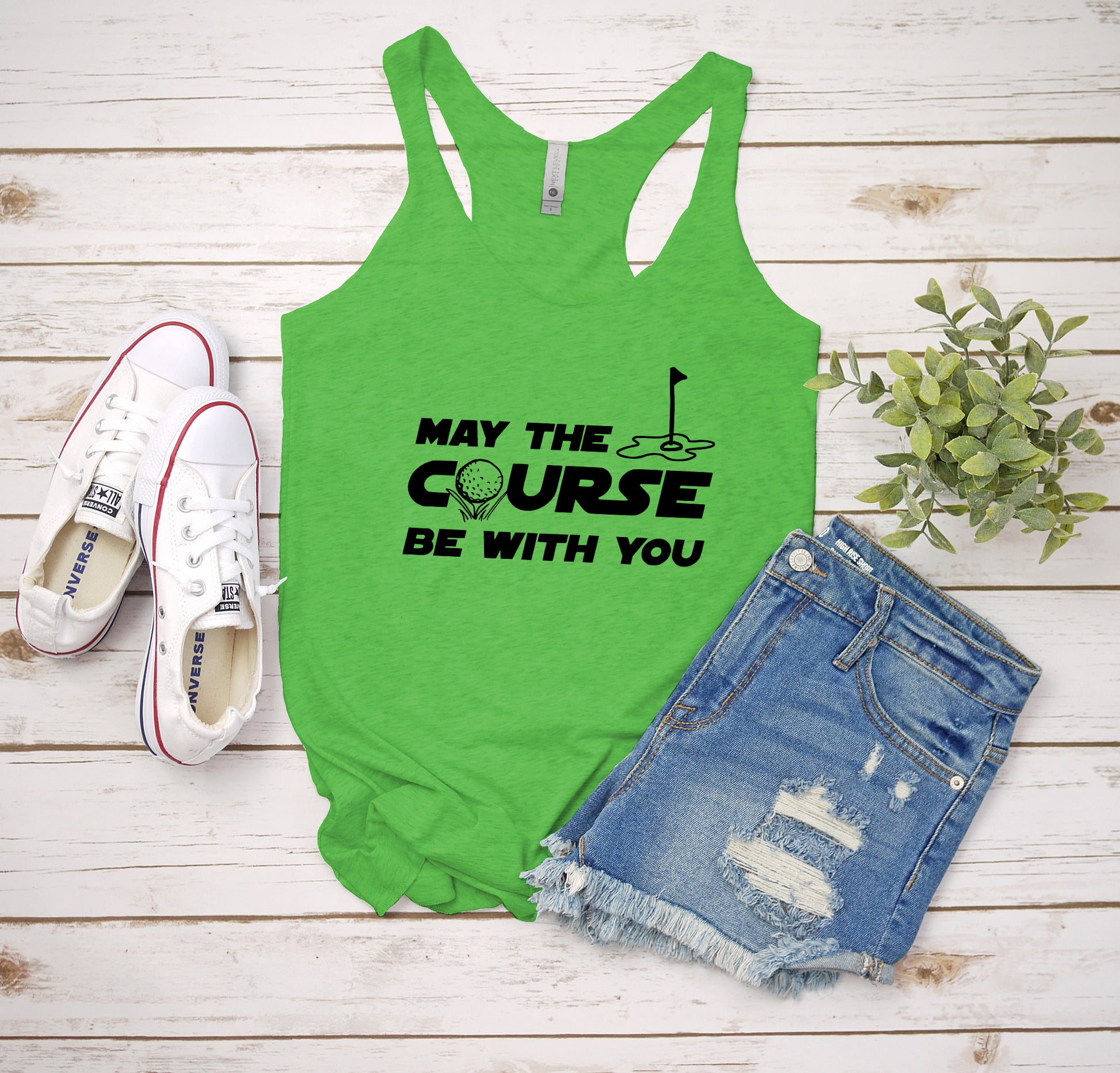 a green tank top that says may the course be with you