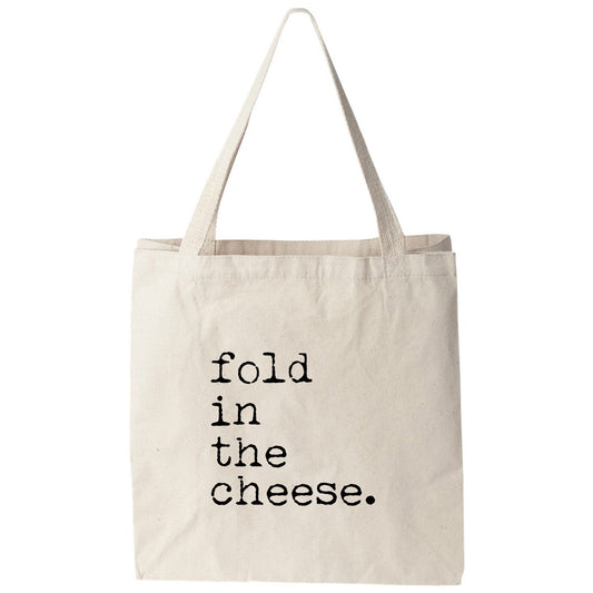 a tote bag that says fold in the cheese
