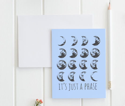 a card with a picture of the moon and the words it's just a