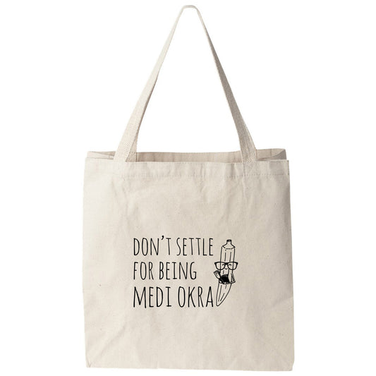 a tote bag that says don't setle for being mediokra