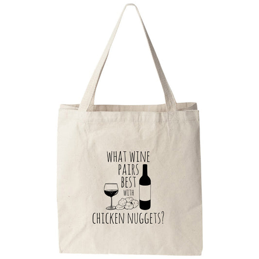a tote bag that says, what wine pairs best with chicken nuggies