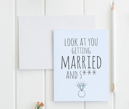 a card with a picture of a wedding ring on it