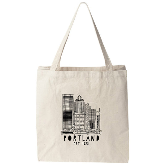 a tote bag with a picture of the portland skyline