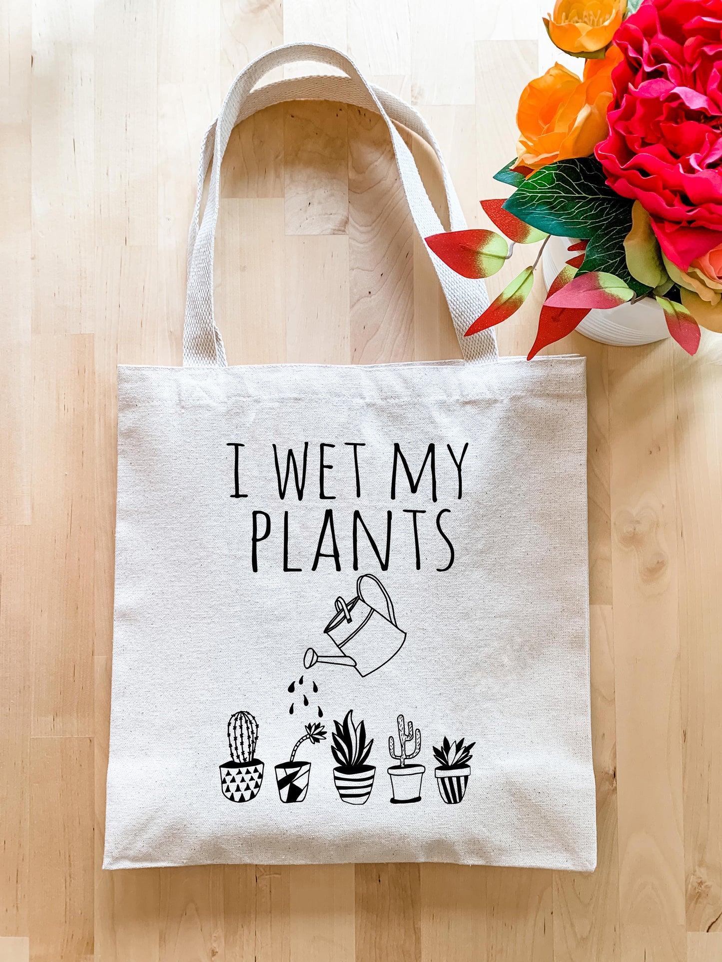 a tote bag that says i wet my plants