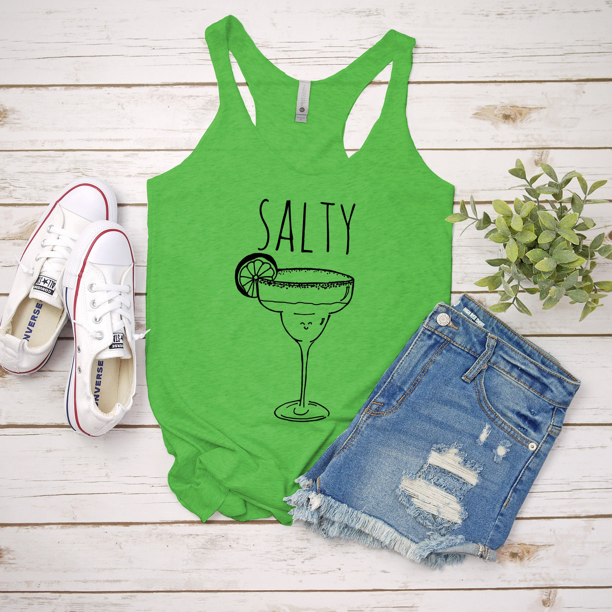 a tank top that says salty with a margarita in it