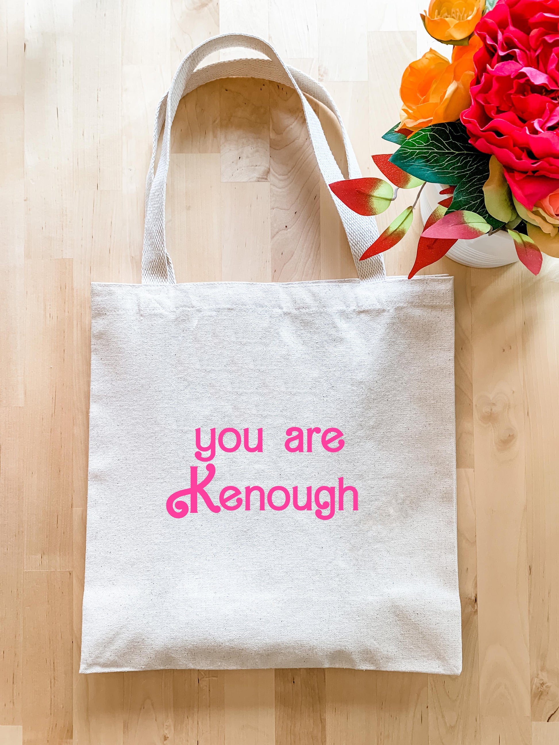 a white tote bag with the words you are kenouh printed on it