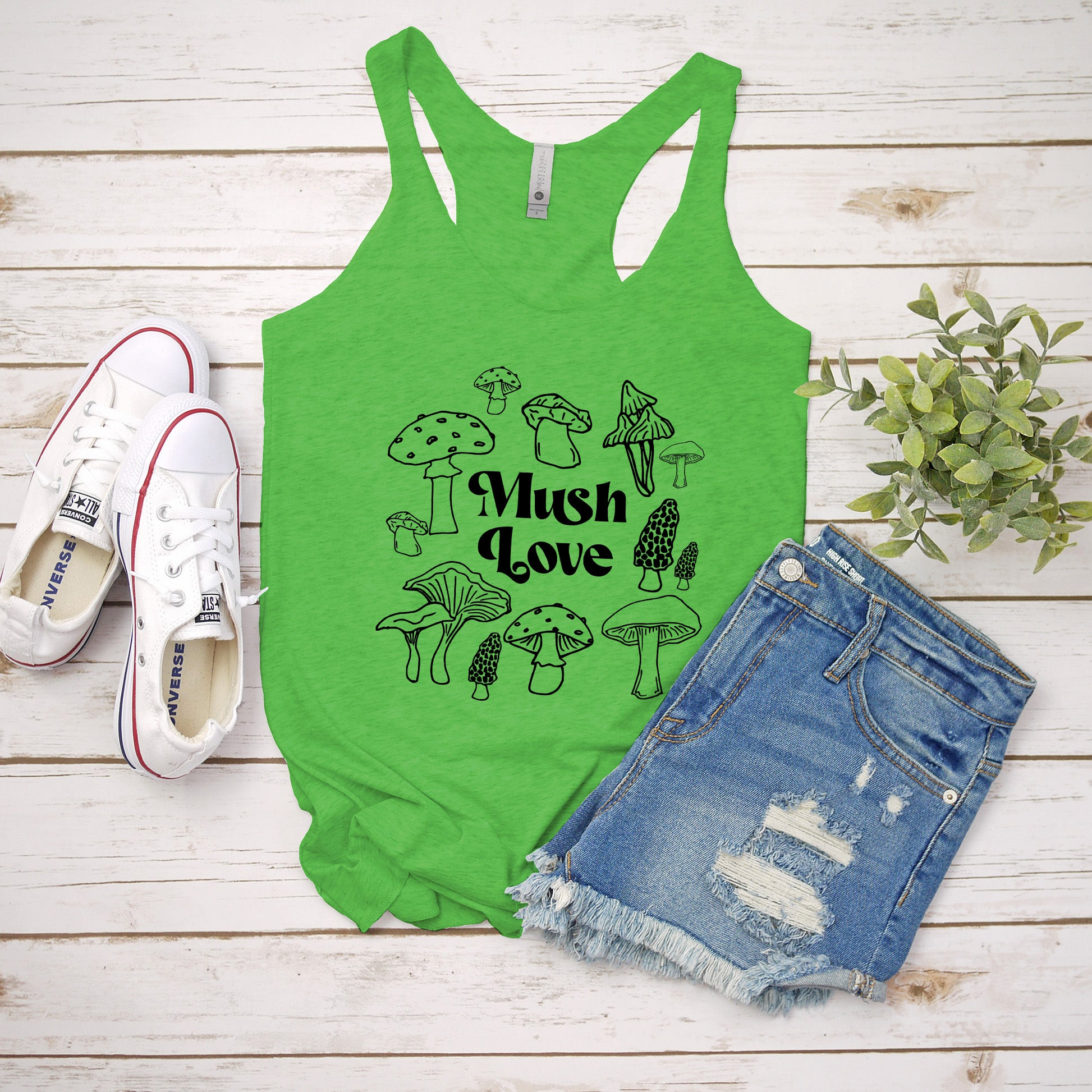 a green tank top with mushrooms on it