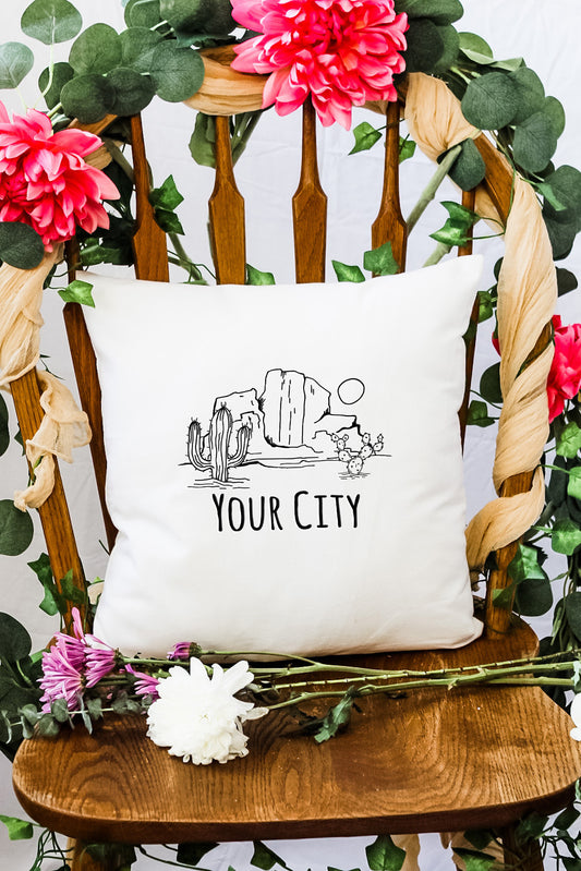 a chair with a pillow that says your city on it