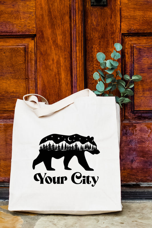 a white bag with a bear on it sitting in front of a door