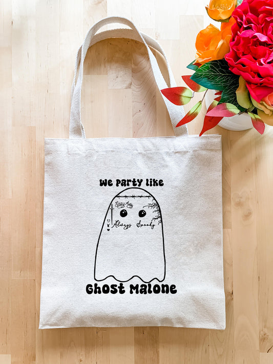 a white tote bag with a picture of a ghost on it