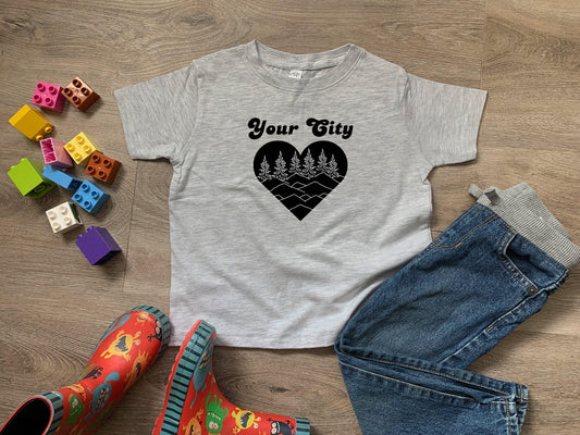 a t - shirt that says your city with a heart and trees on it