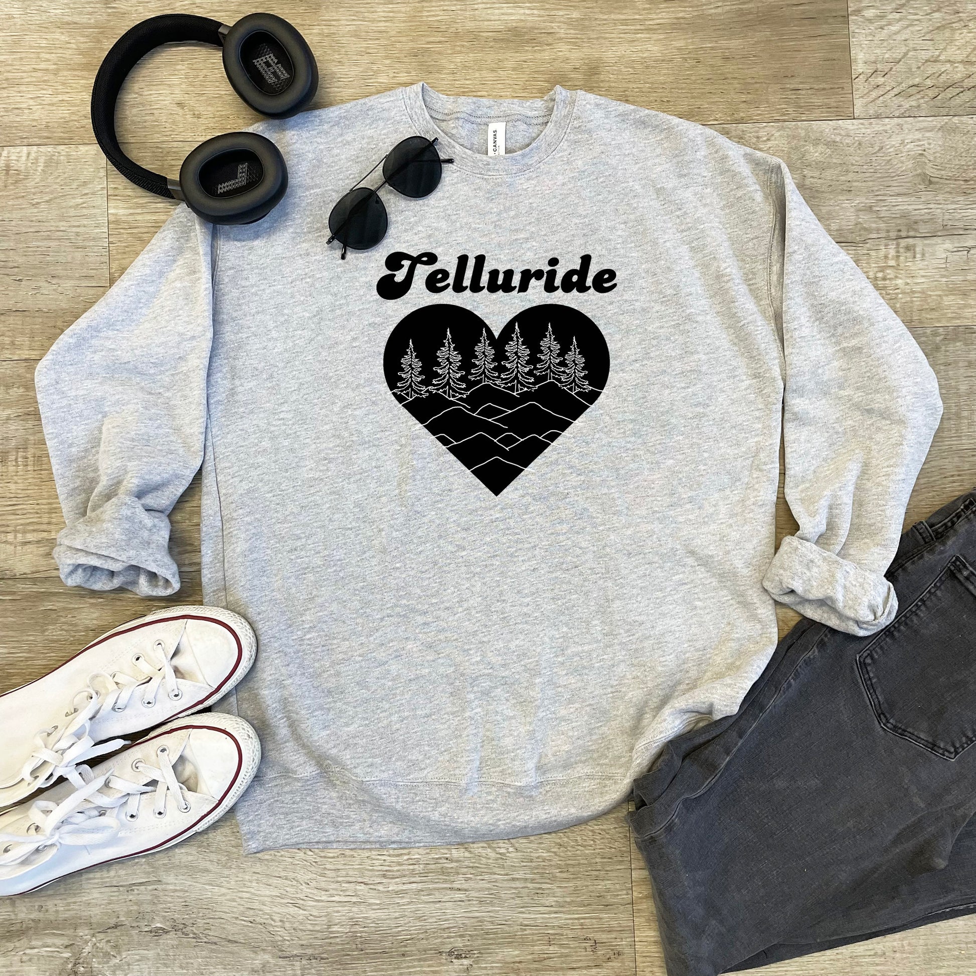 a sweatshirt that says telluride with a heart and trees on it