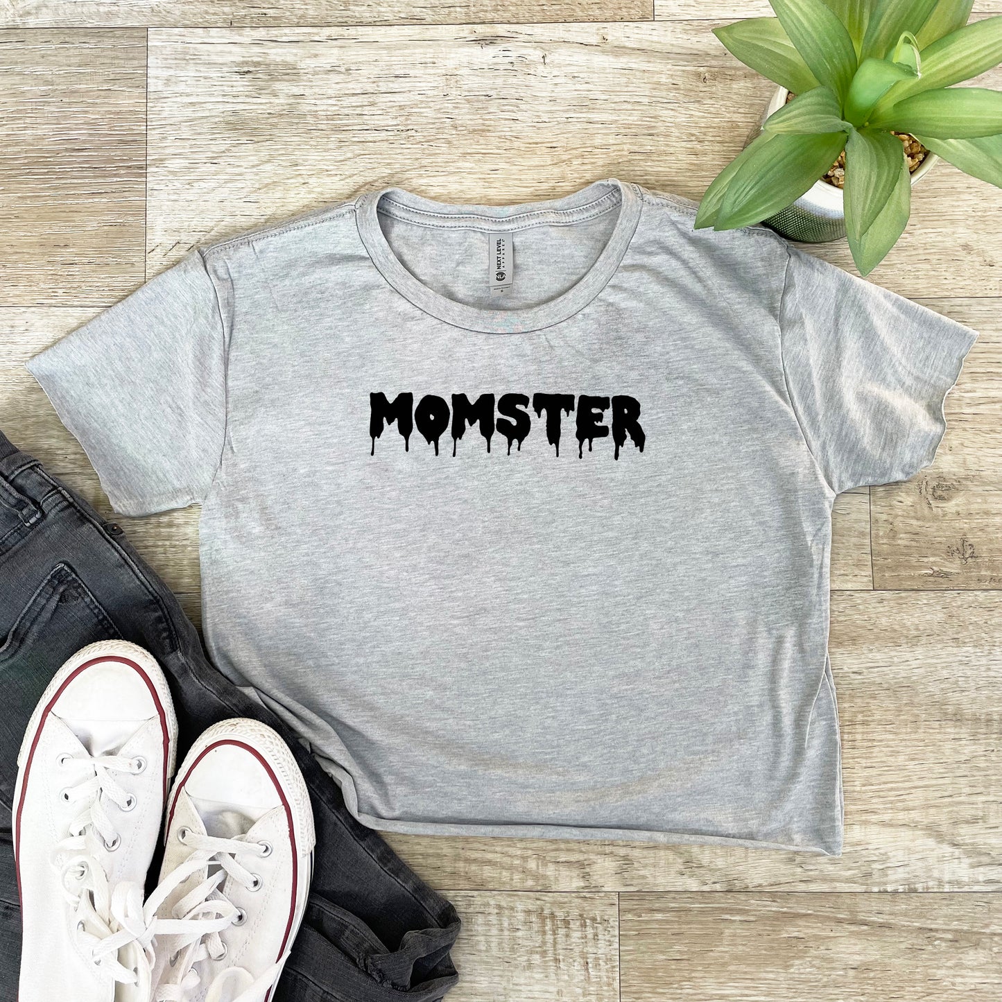 a grey shirt with the word monster printed on it