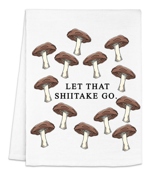 a tea towel with mushrooms on it that says let that shiitake go