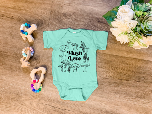 a baby bodysuit that says, wish love with mushrooms on it