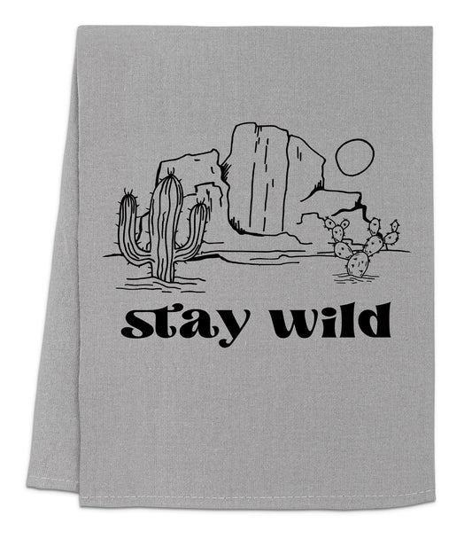 a towel with the words stay wild printed on it