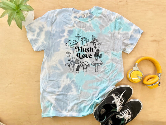 a t - shirt that says wish love on it next to a pair of head
