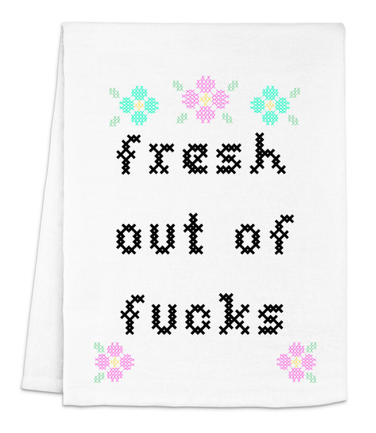 a white dish towel with a cross - stitch design that says, fresh out of