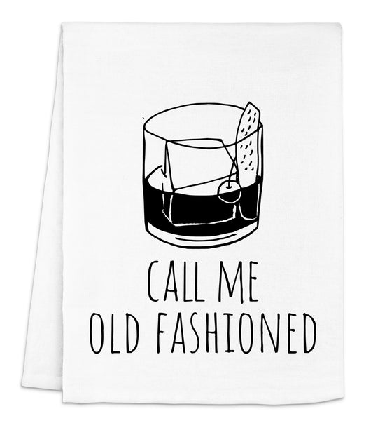 a tea towel with a glass of alcohol on it