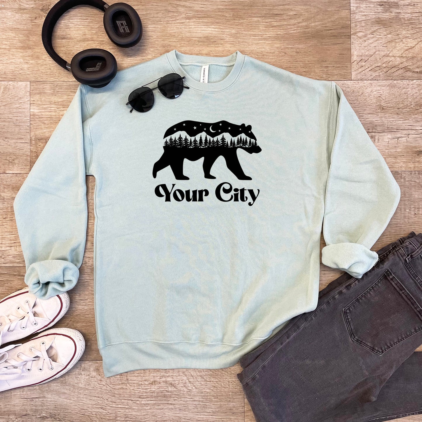 a sweater that says your city with a bear on it