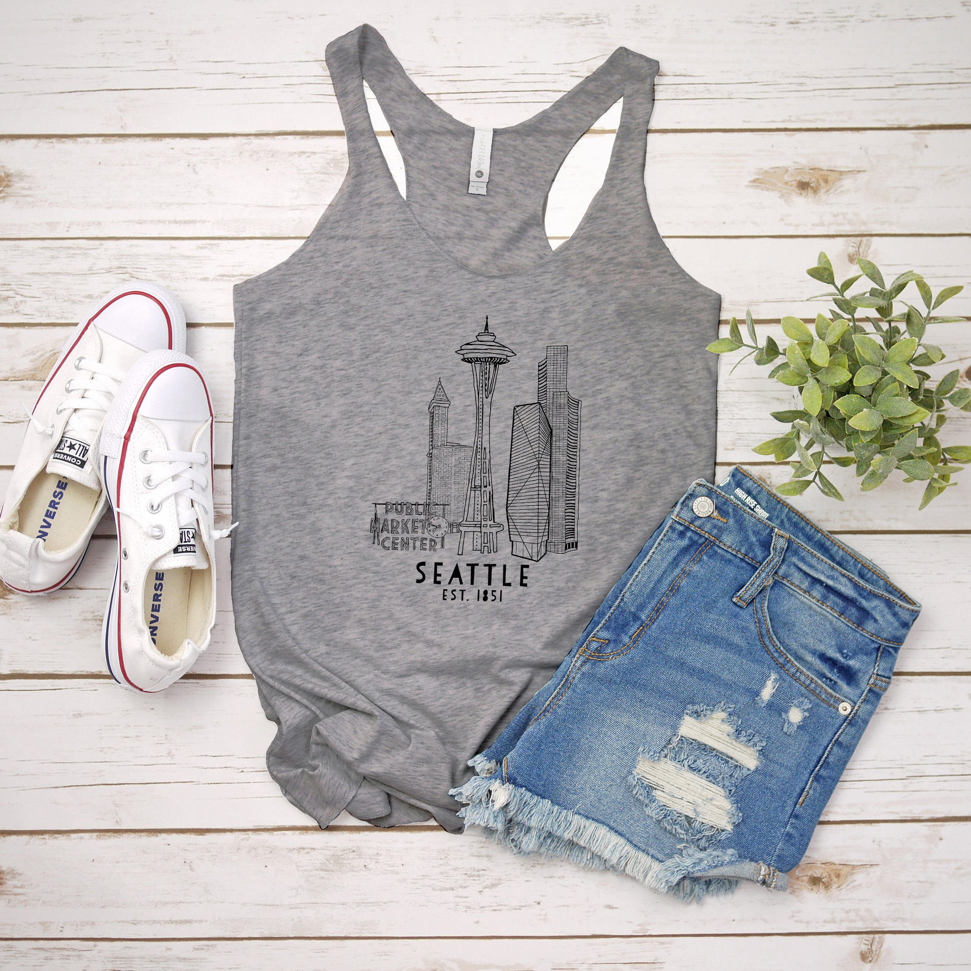 a women's tank top with seattle skyline on it