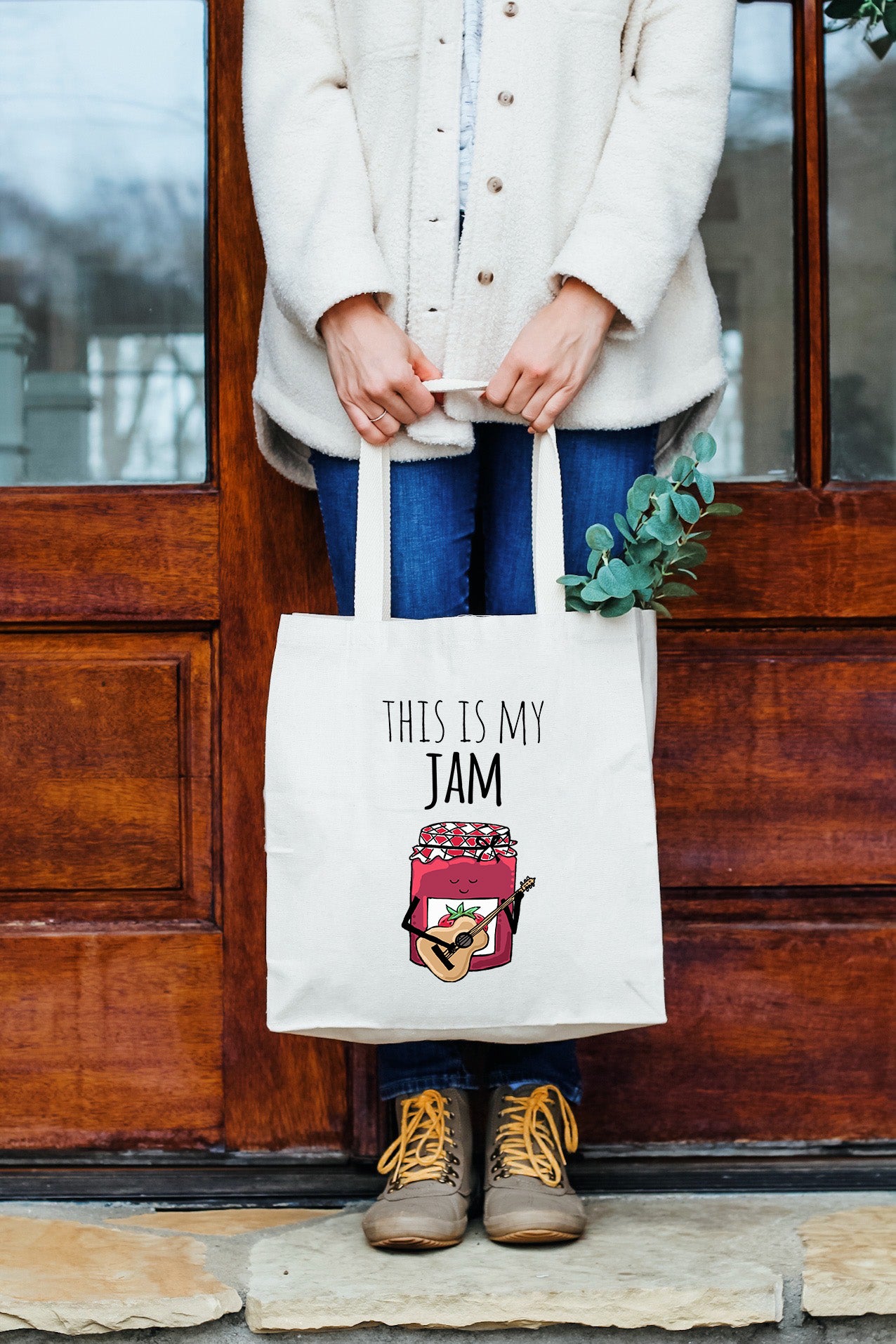 a woman holding a bag that says, this is my jam
