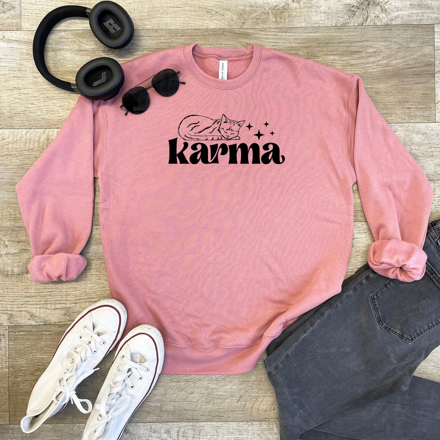 a pink sweatshirt with the words karma on it