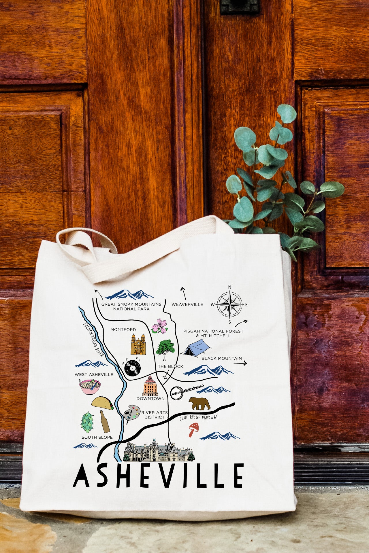 a white tote bag with a map of nashville on it