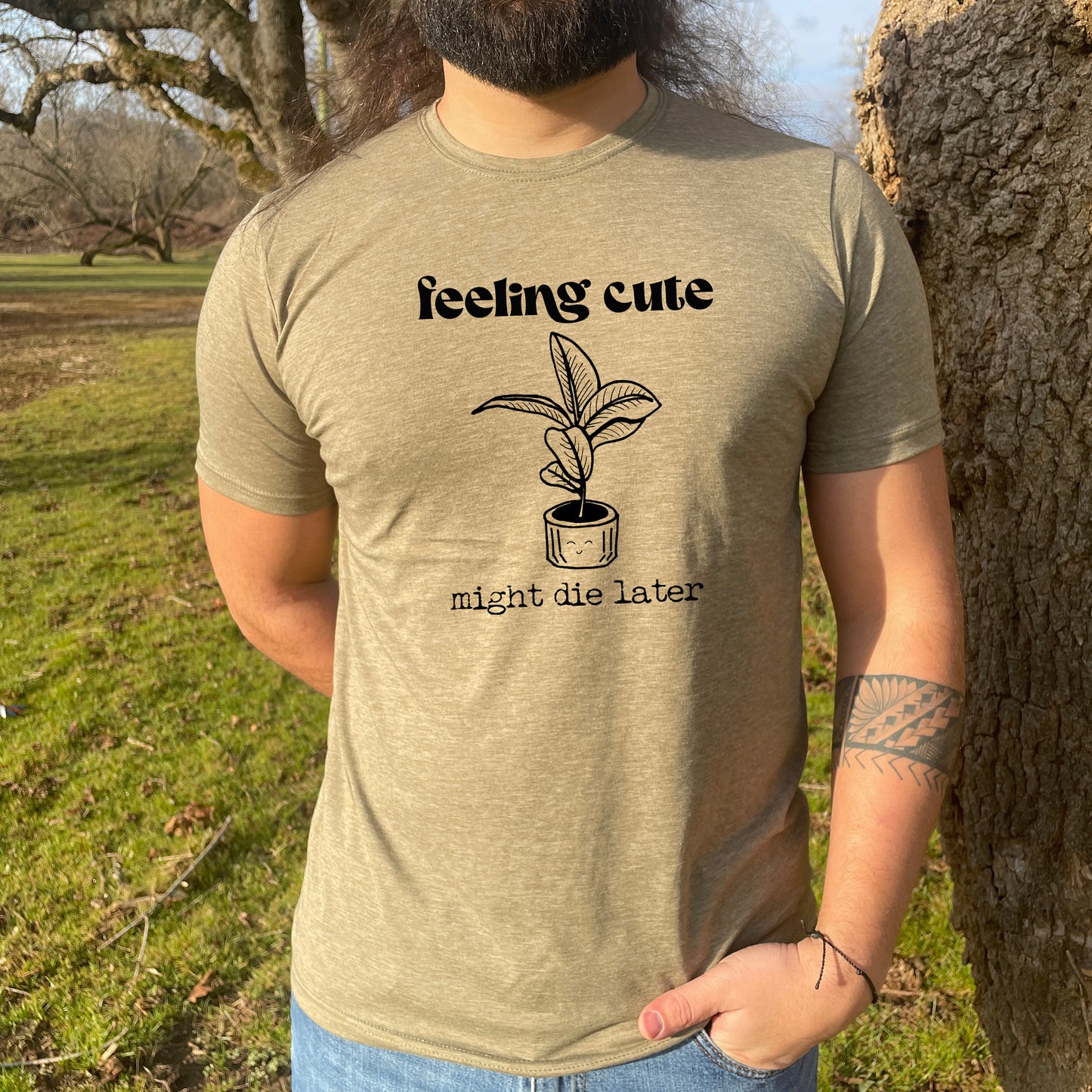 a man with a beard wearing a t - shirt that says feeling cute might be