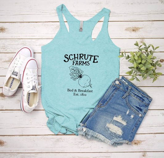 a tank top that says schrute farms next to a pair of shorts