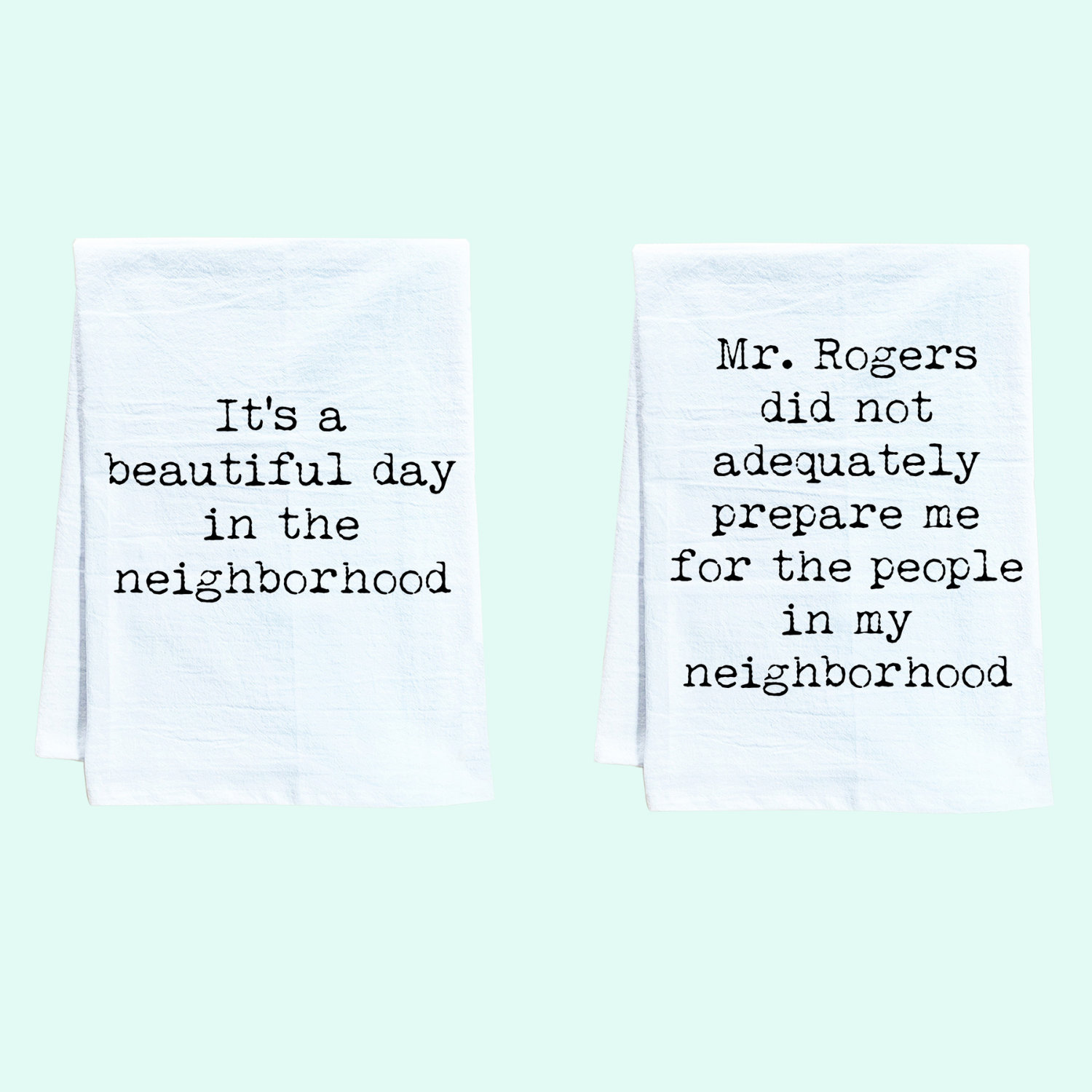 two tea towels with words written on them