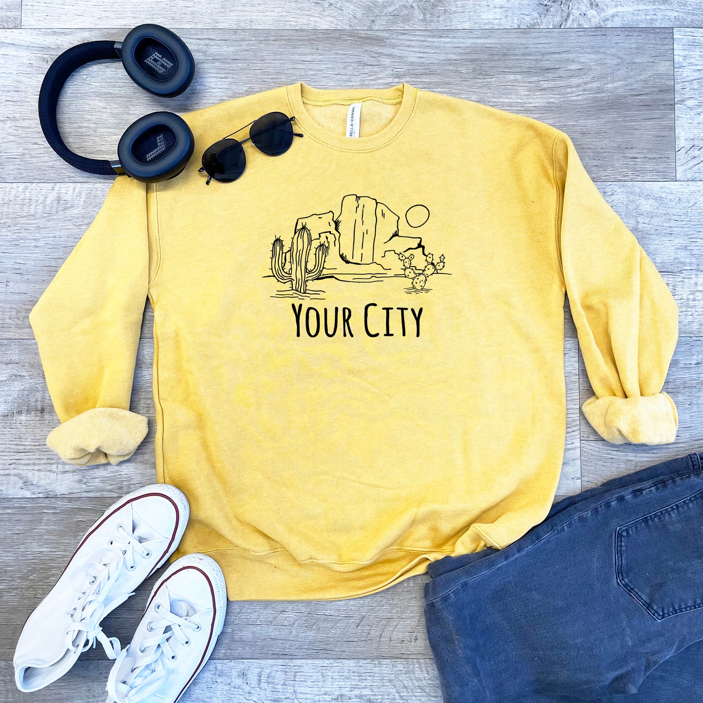 a yellow sweatshirt with the words your city on it