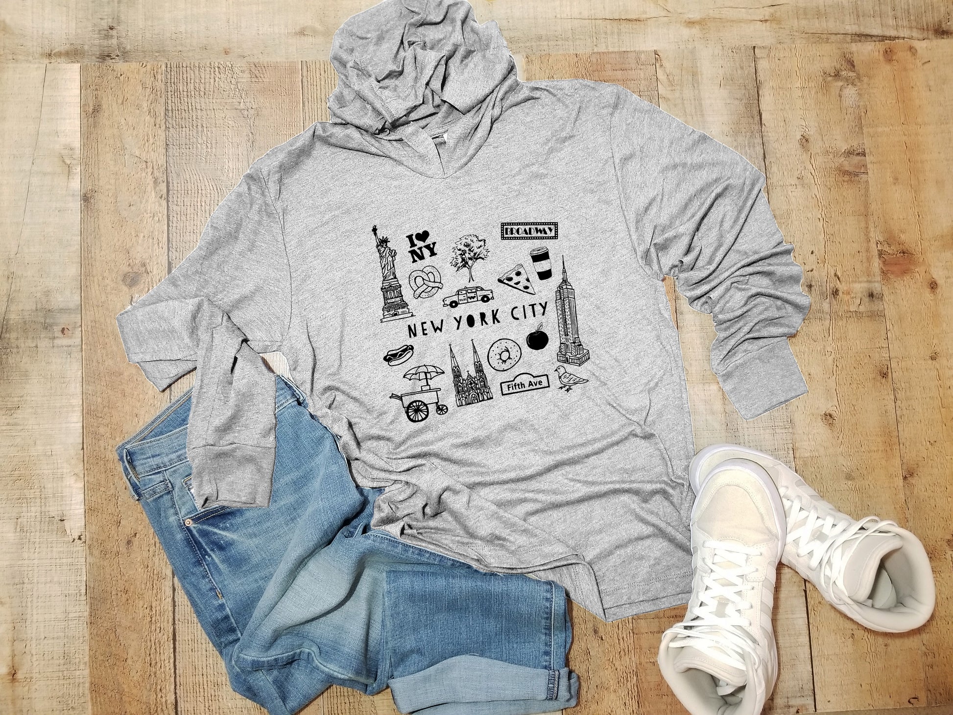 a gray hoodie with a picture of a city on it