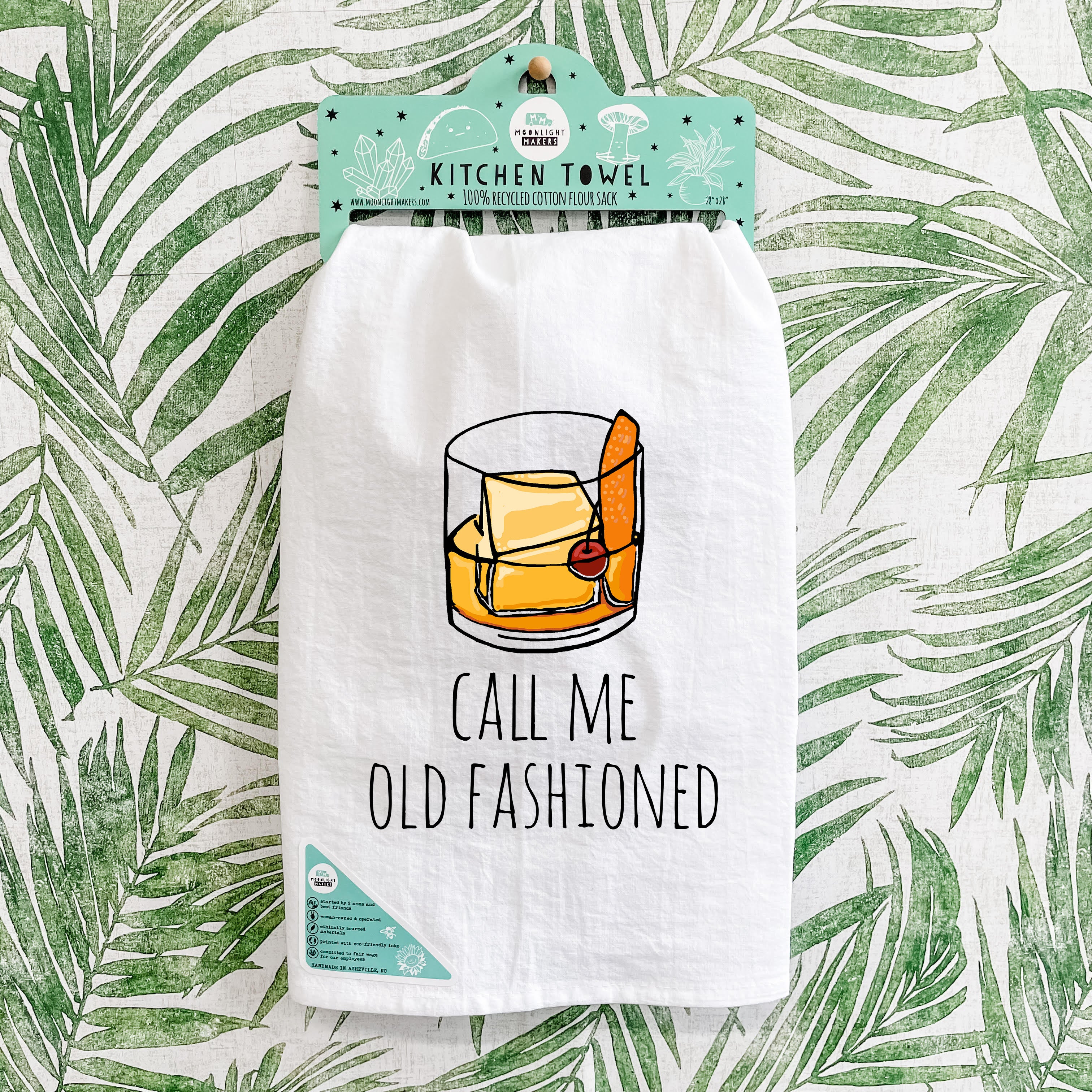 a tea towel with a picture of a glass of whiskey