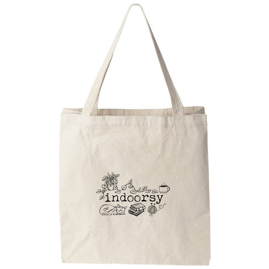 a white tote bag with the words indoors on it
