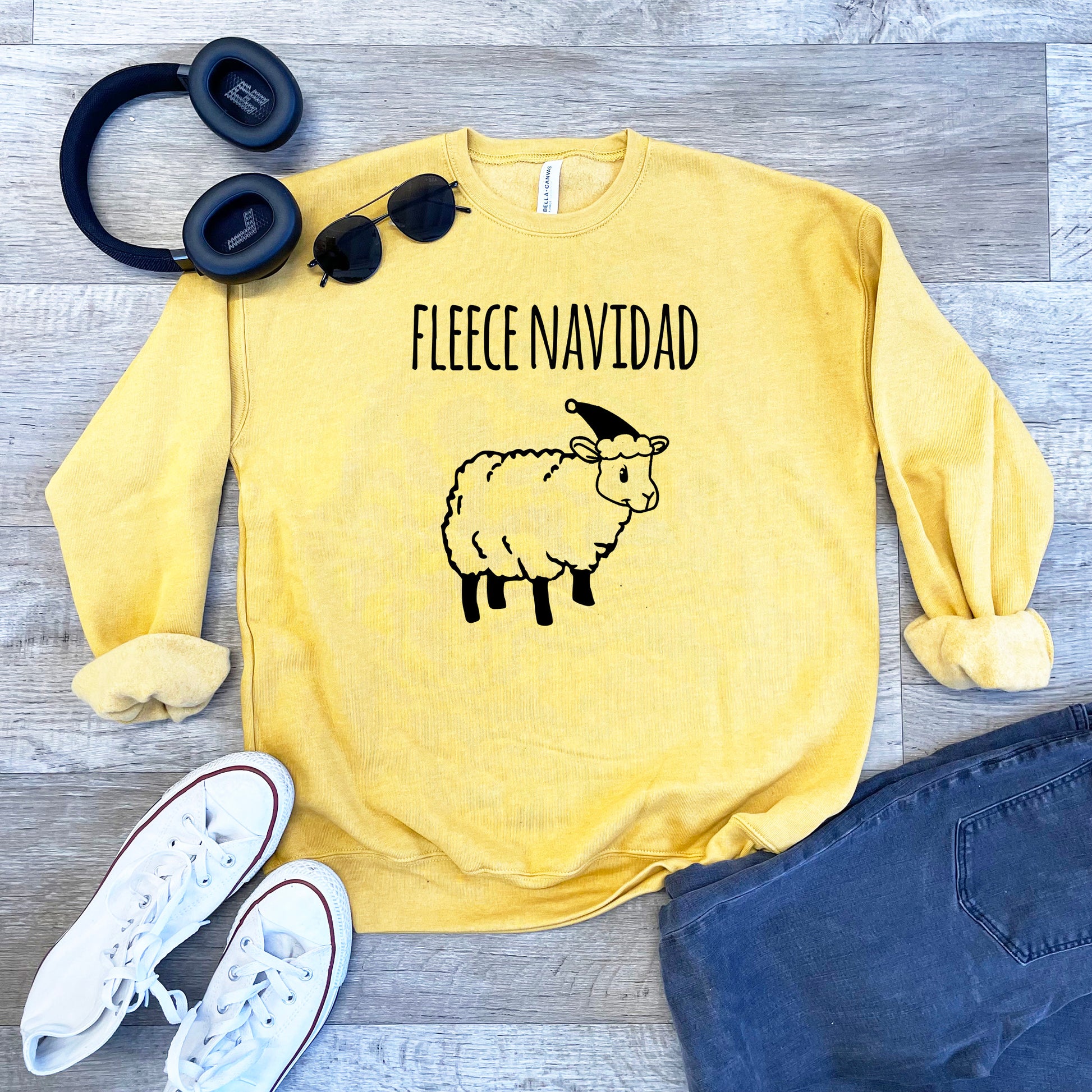 a yellow sweatshirt with a sheep on it