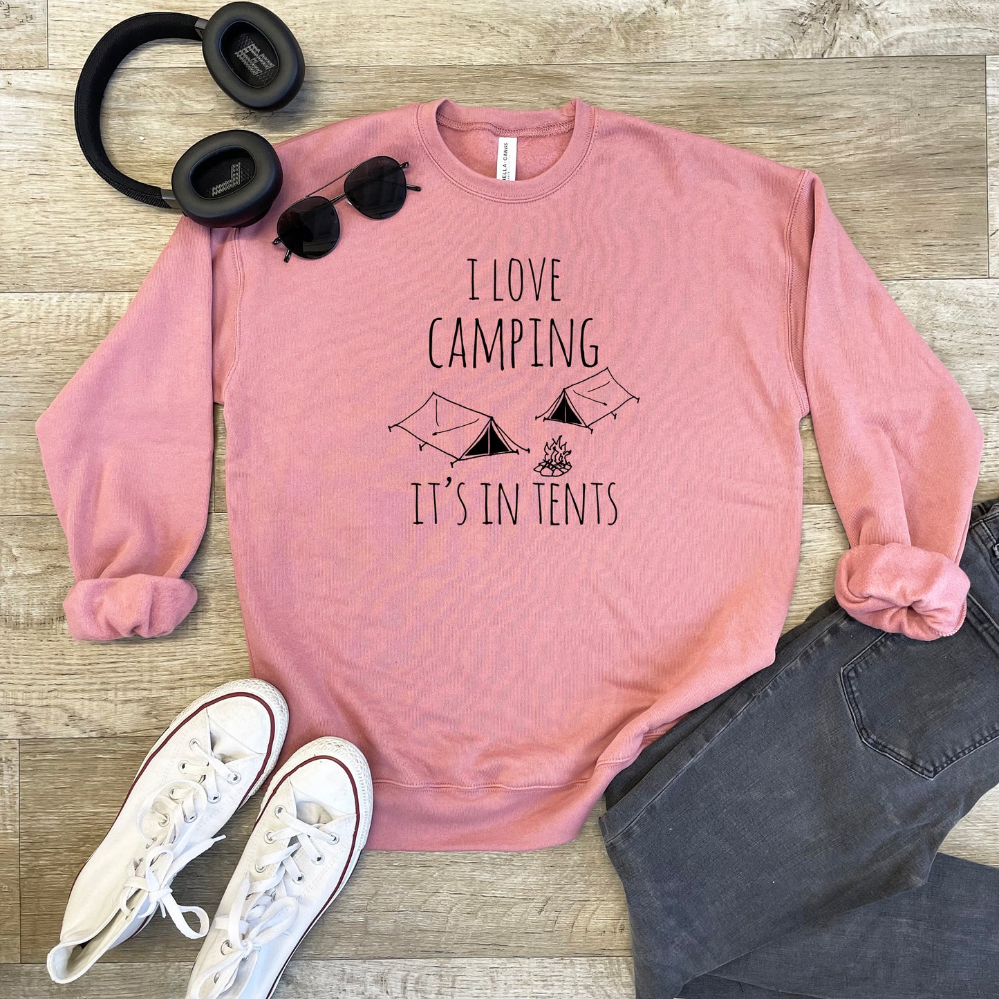 a pink sweatshirt that says i love camping it's in tents