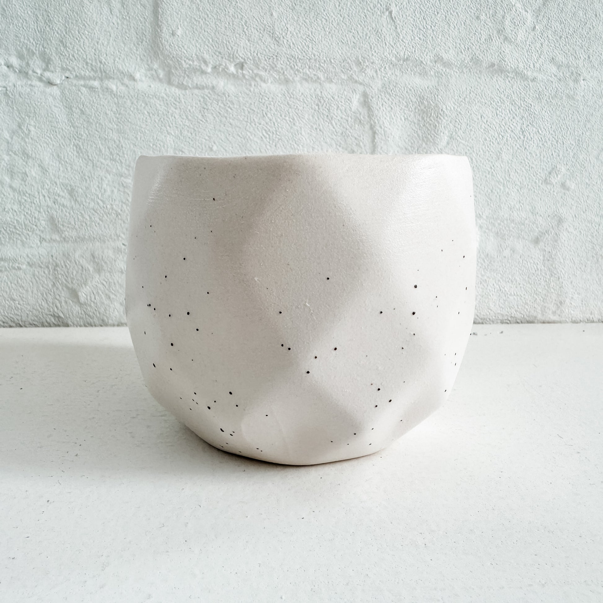 a white bowl sitting on top of a table