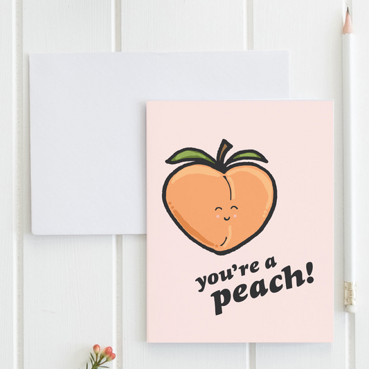 a greeting card with a peach on it