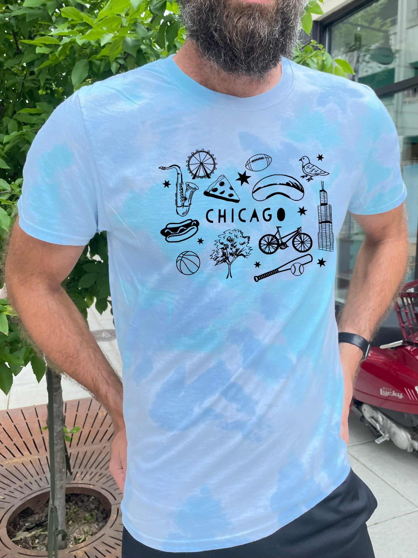 a man with a beard wearing a chicago t - shirt