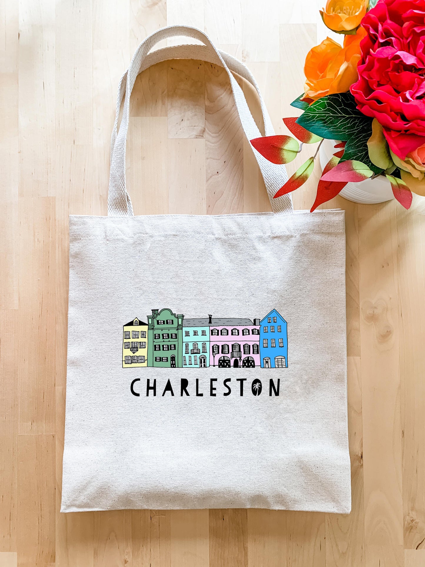 a tote bag with a picture of charleston on it