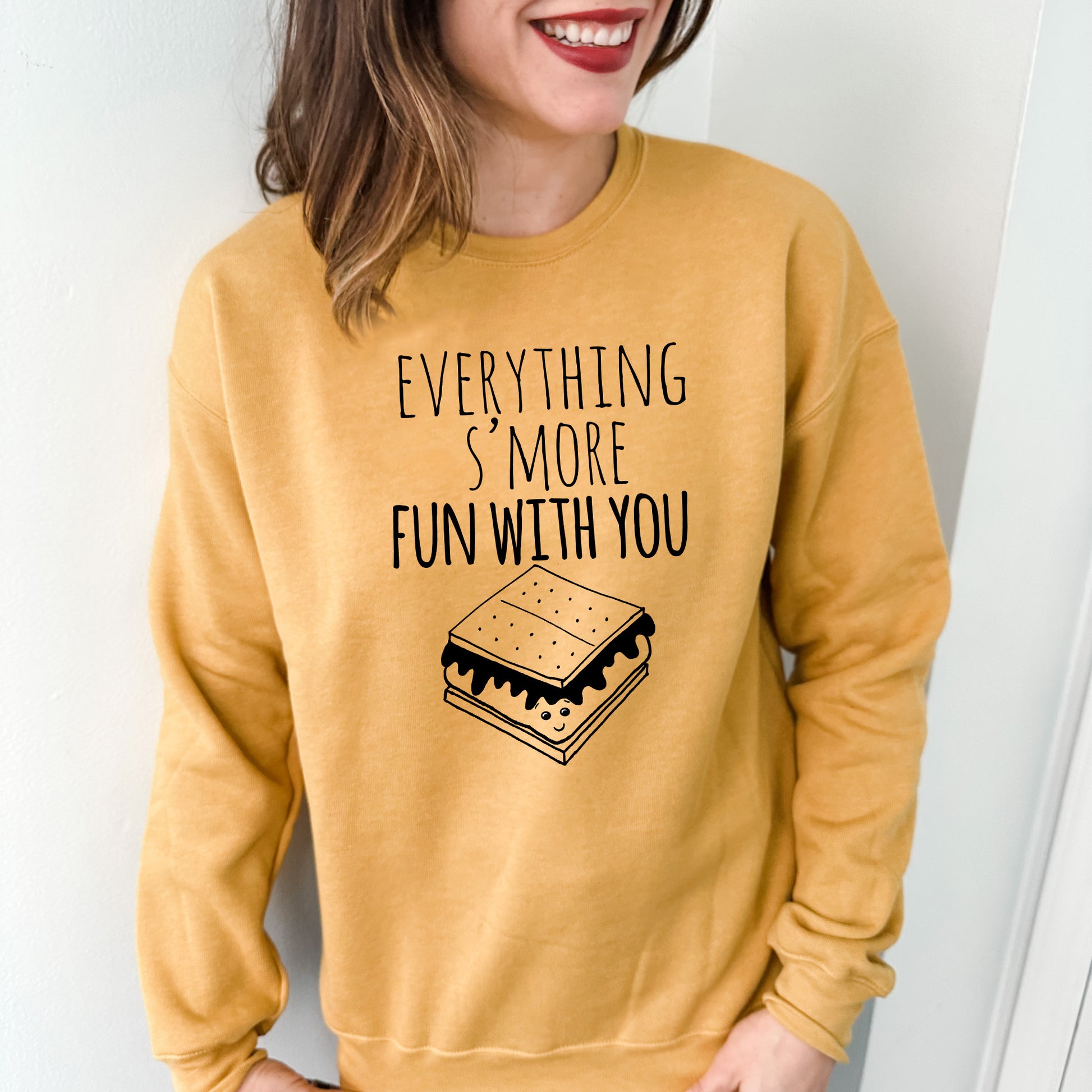 a woman wearing a sweatshirt that says everything's more fun with you