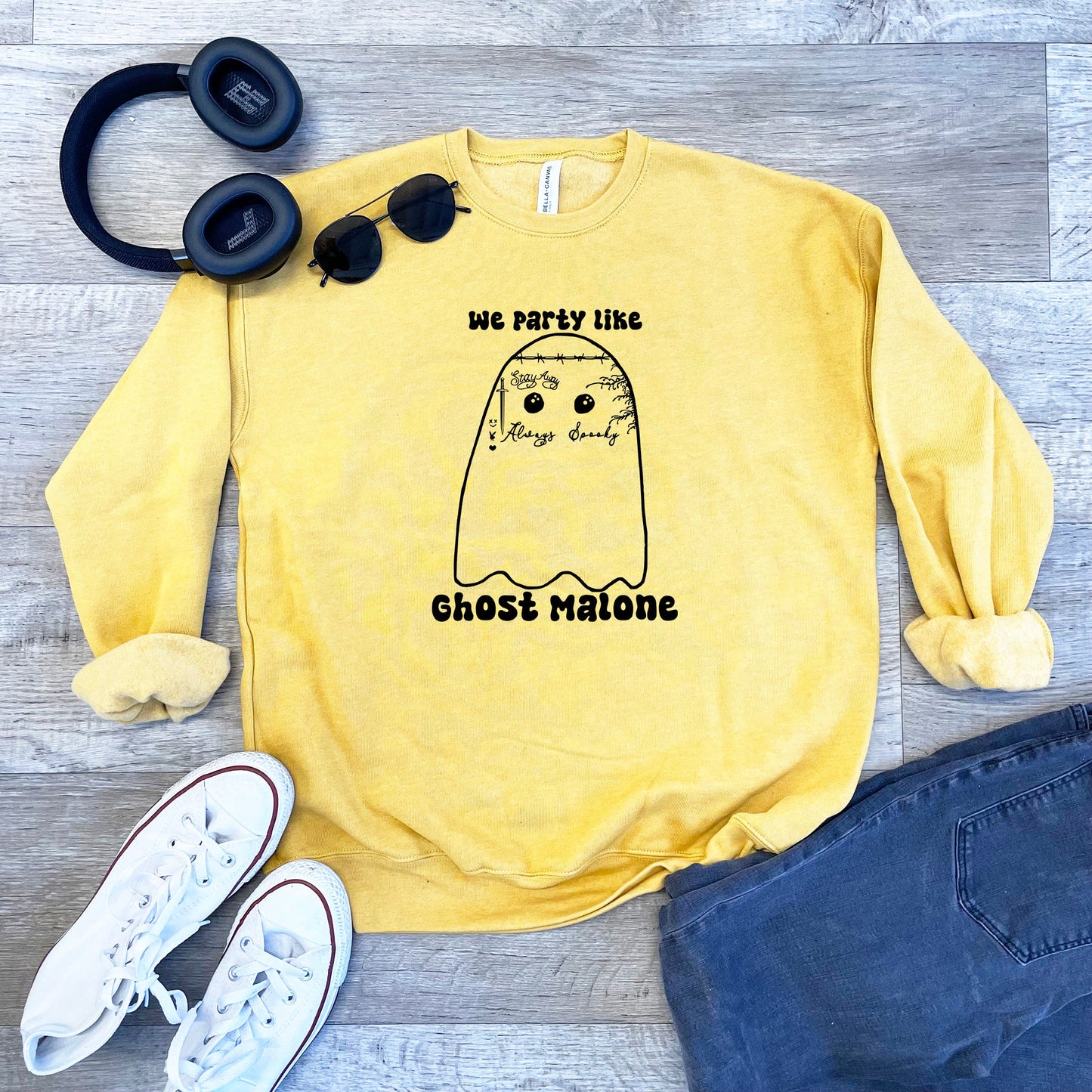 a yellow sweatshirt with a ghost on it