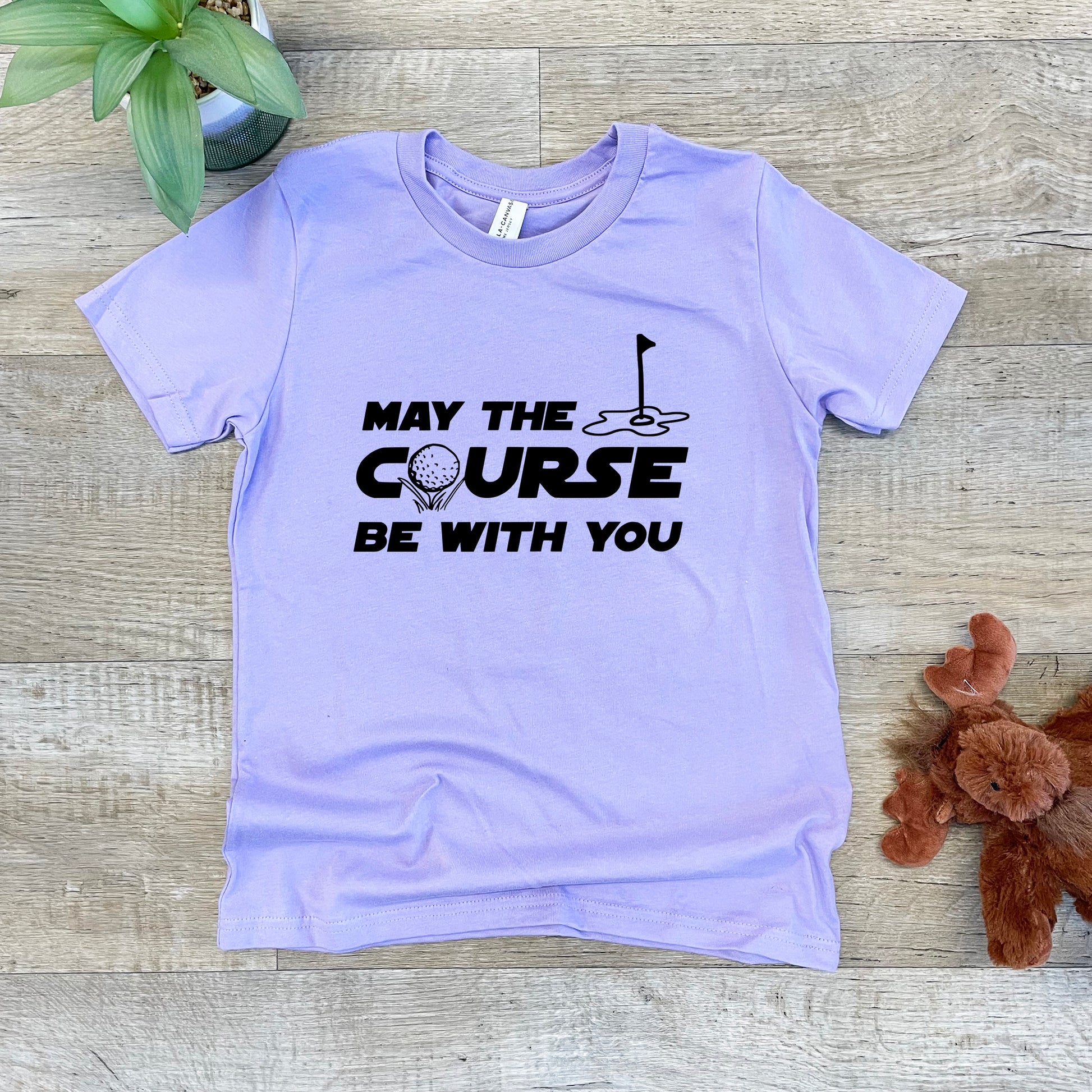 a t - shirt that says may the course be with you next to a teddy