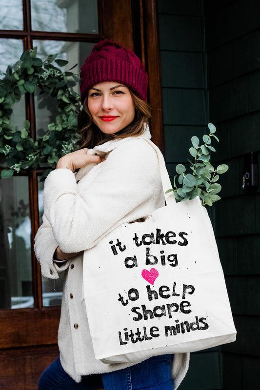 a woman carrying a bag with a message on it