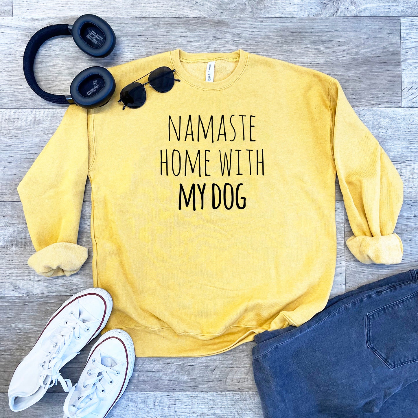 a yellow sweatshirt that says namaste home with my dog