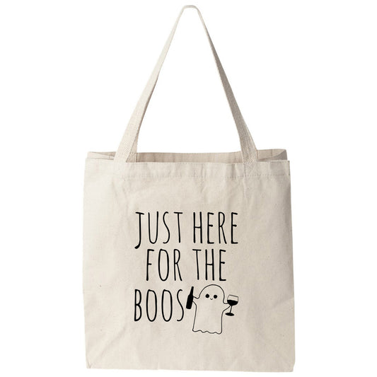 a tote bag that says just here for the boos